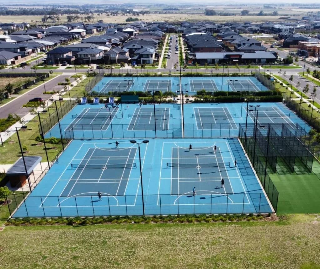 Aerial view of the ten blue hard courts at Aintree Tennis Club
